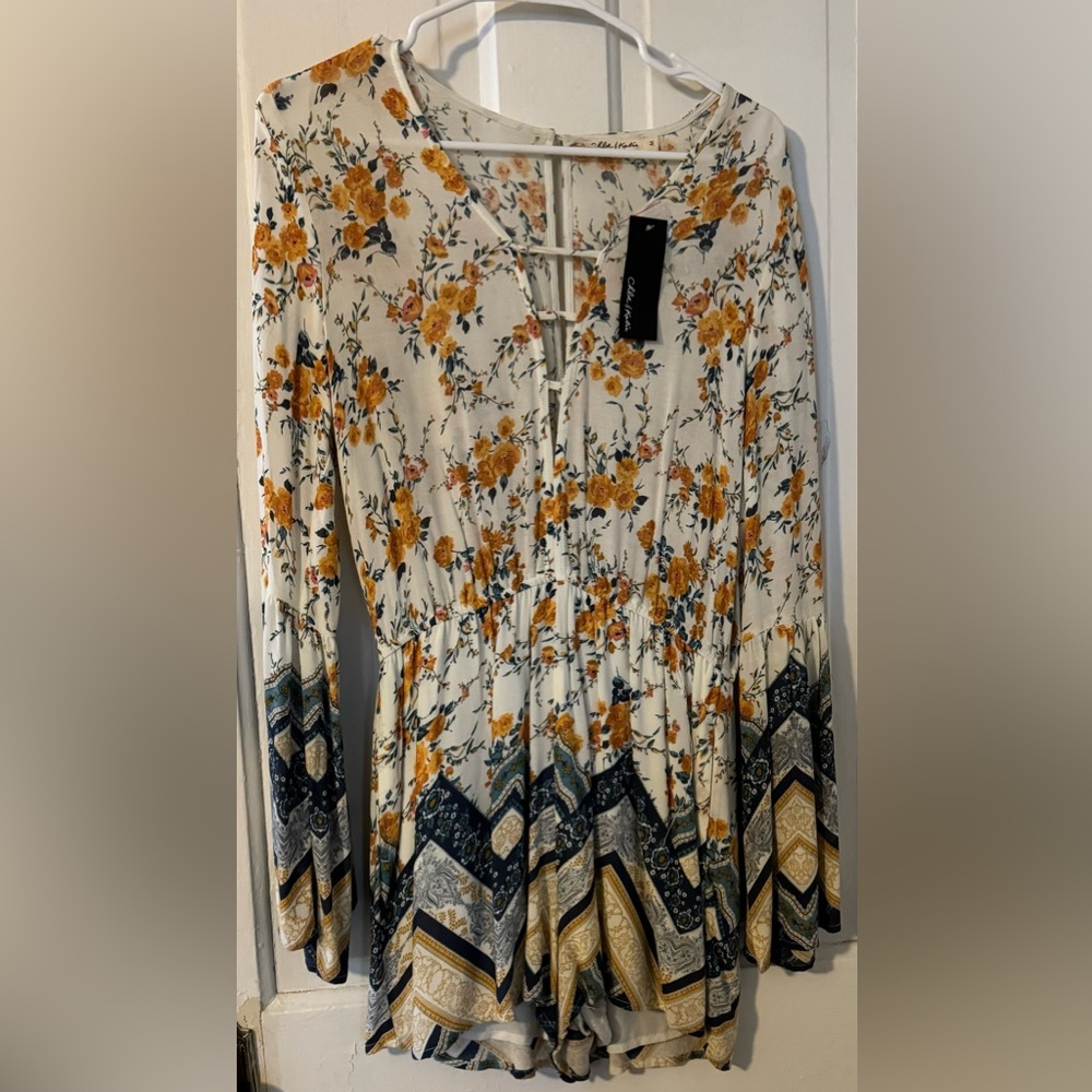 Super cute romper with tags!